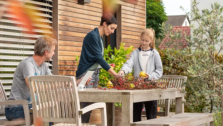 Family in the garden in autumn