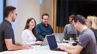Group of people at a high table