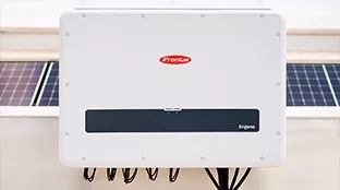 Fronius Argeno inverter on rooftop before pv modules