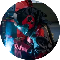 Welder using Fronius welding helmet Sirix
