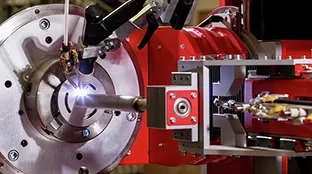 Close-up of the torch: Fronius FCW-Smart welding cell.
