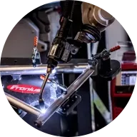 Robot welds linkage